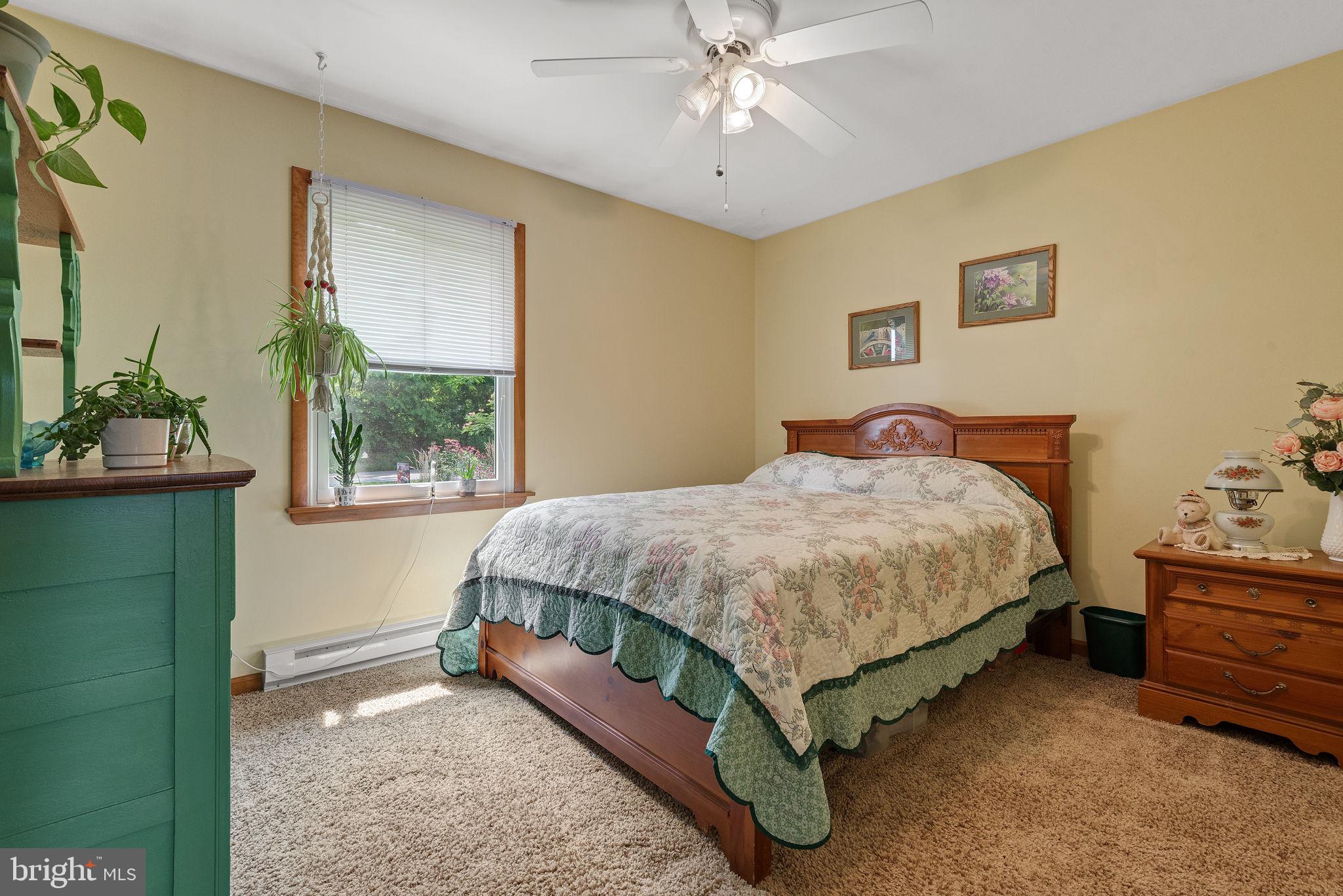 4451 Pine Hill Road Dover, PA 17315 - Photo 17 of 36 a bedroom with a bed and a window