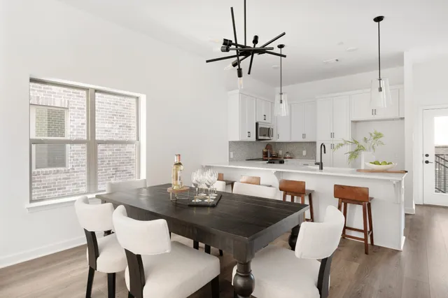a view of a kitchen with wooden floor