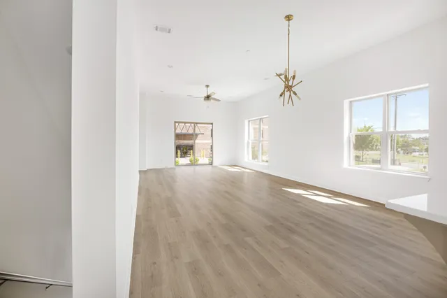 a view of kitchen with wooden floor and window