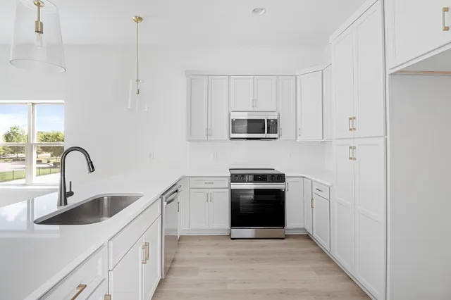 a kitchen with a table and chairs in it