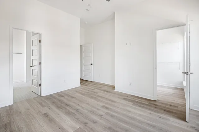 a kitchen with white cabinets sink and stainless steel appliances