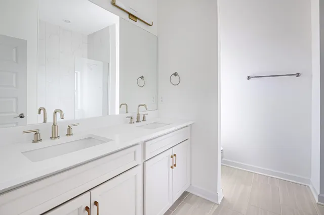 a kitchen with a sink cabinets and a window