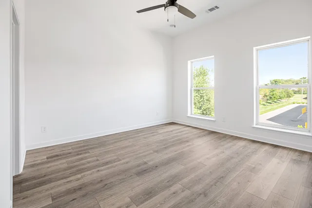 a bedroom with a bed and dresser