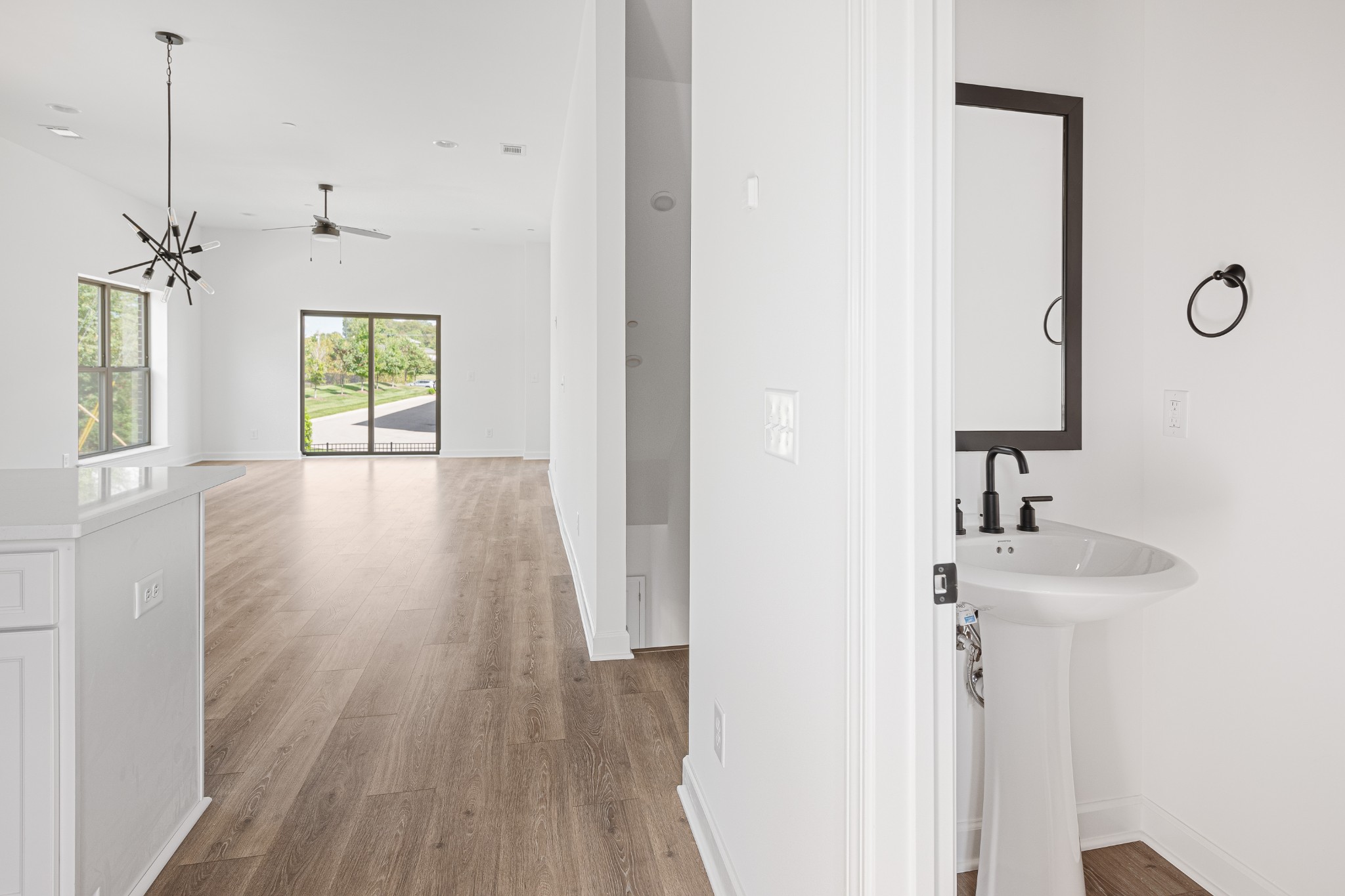 225 B Folsom Pass Spring Hill Spring Hill, TN 37174 - Photo 48 of 100 a view of a hallway with wooden floor and a bathroom