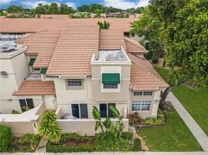 6659 Via Regina, Unit 6659 Boca Raton, FL 33433 - Photo 1 of 38 a aerial view of a house with a yard and lake view