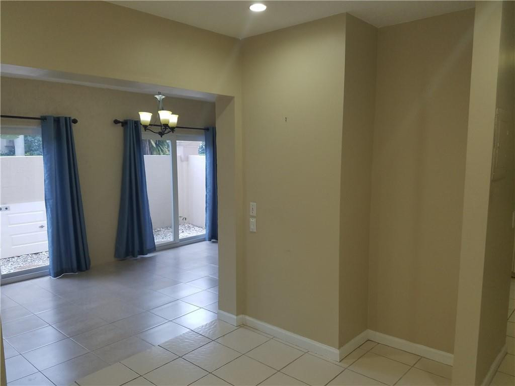 6659 Via Regina, Unit 6659 Boca Raton, FL 33433 - Photo 11 of 38 a view of gallery with chandelier