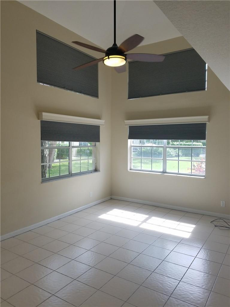 6659 Via Regina, Unit 6659 Boca Raton, FL 33433 - Photo 2 of 38 a view of an empty room with a window