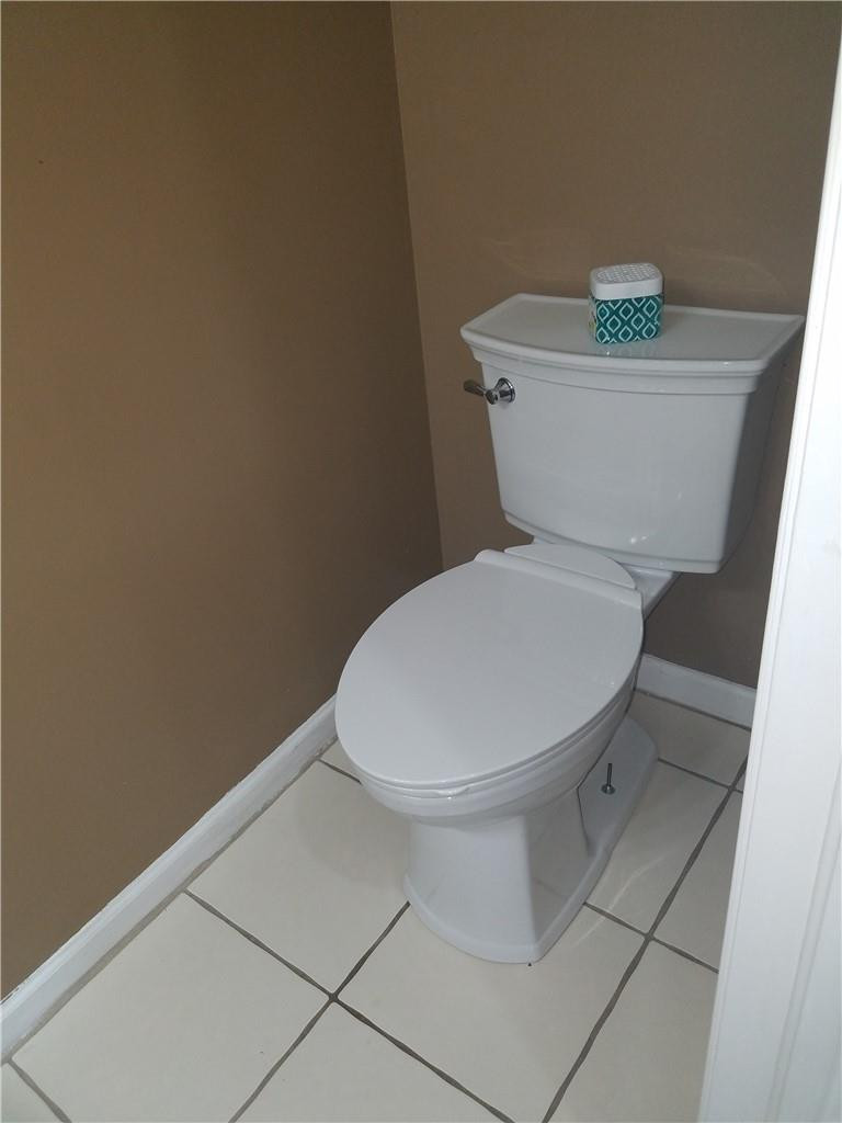 6659 Via Regina, Unit 6659 Boca Raton, FL 33433 - Photo 30 of 38 a white toilet sitting next to a white wall