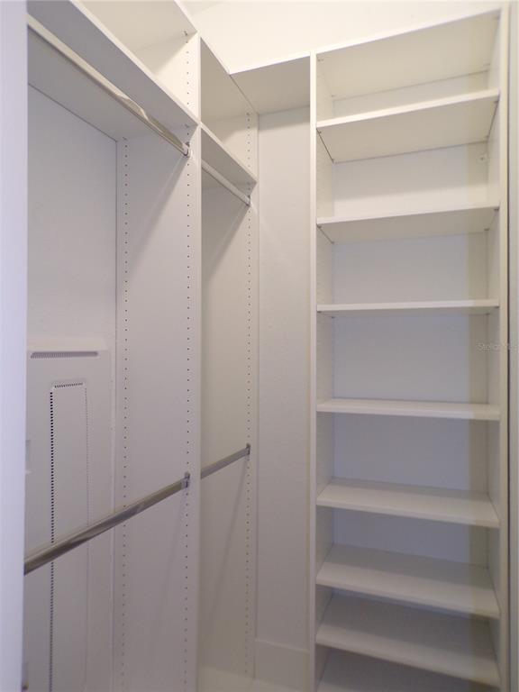 14271 Heritage Landing Boulevard, Unit 1526 Punta Gorda, FL 33955 - Photo 16 of 41 a view of walk in closet with empty racks