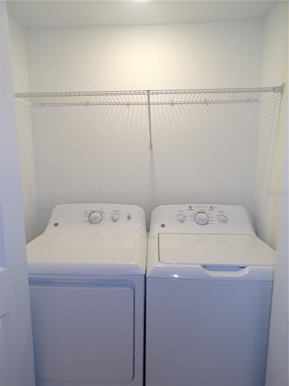 14271 Heritage Landing Boulevard, Unit 1526 Punta Gorda, FL 33955 - Photo 19 of 41 a utility room with dryer and washer