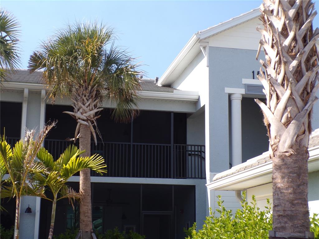 14271 Heritage Landing Boulevard, Unit 1526 Punta Gorda, FL 33955 - Photo 2 of 41 a view of a house with a flower garden