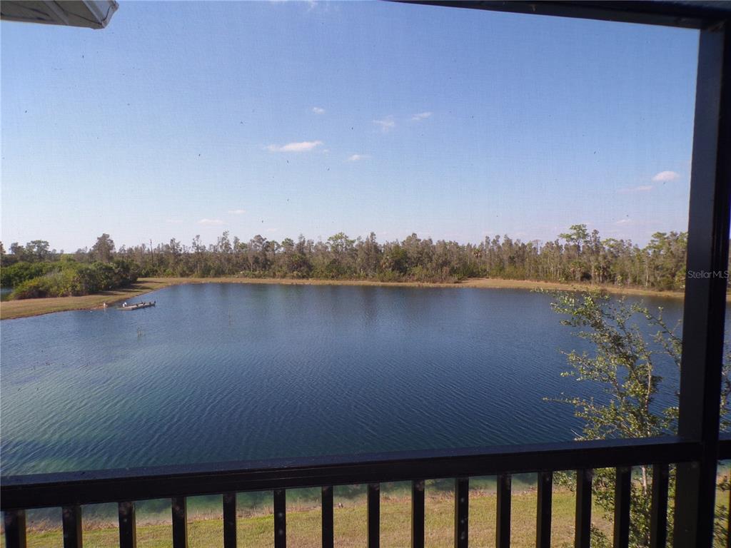 14271 Heritage Landing Boulevard, Unit 1526 Punta Gorda, FL 33955 - Photo 27 of 41 a view of a lake from a balcony