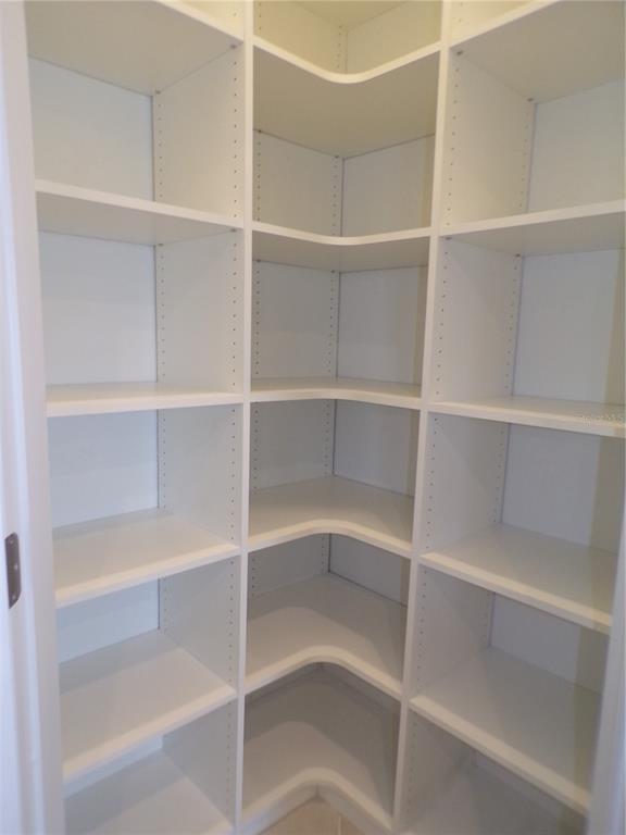 14271 Heritage Landing Boulevard, Unit 1526 Punta Gorda, FL 33955 - Photo 29 of 41 a view of walk in closet with empty racks