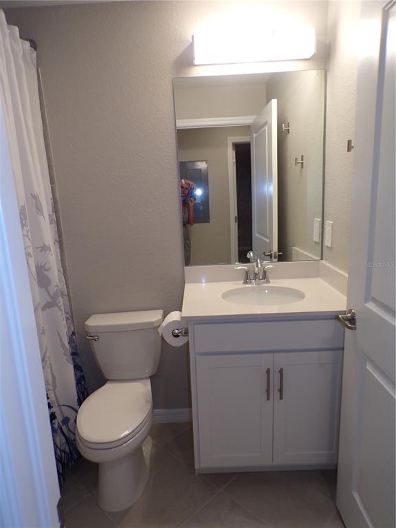 14271 Heritage Landing Boulevard, Unit 1526 Punta Gorda, FL 33955 - Photo 9 of 41 a bathroom with a sink mirror vanity and toilet