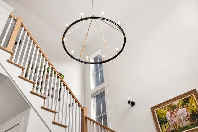 a view of staircase with wooden floor and a window