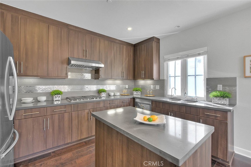 1058 Sunset Boulevard, Unit B Arcadia, CA 91007 - Photo 11 of 45 a kitchen with stainless steel appliances a sink a stove and a refrigerator