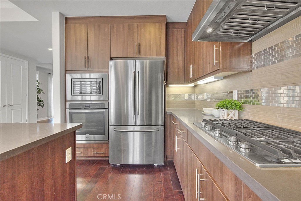 1058 Sunset Boulevard, Unit B Arcadia, CA 91007 - Photo 14 of 45 a kitchen with granite countertop stainless steel appliances a refrigerator and a stove top oven