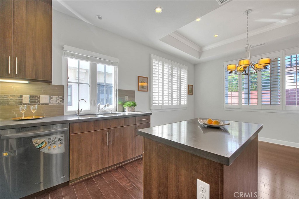 1058 Sunset Boulevard, Unit B Arcadia, CA 91007 - Photo 15 of 45 a kitchen with a sink a window and chairs