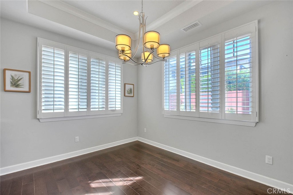 1058 Sunset Boulevard, Unit B Arcadia, CA 91007 - Photo 16 of 45 an empty room with wooden floor and windows