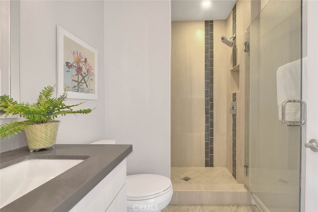 1058 Sunset Boulevard, Unit B Arcadia, CA 91007 - Photo 17 of 45 a bathroom with a toilet a sink and shower