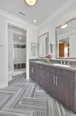 a kitchen with white cabinets sink and stove