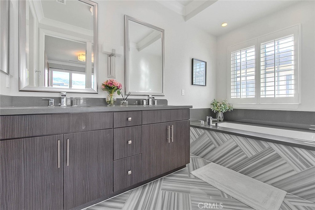1058 Sunset Boulevard, Unit B Arcadia, CA 91007 - Photo 23 of 45 a spacious bathroom with a double vanity sink a mirror and a bathtub