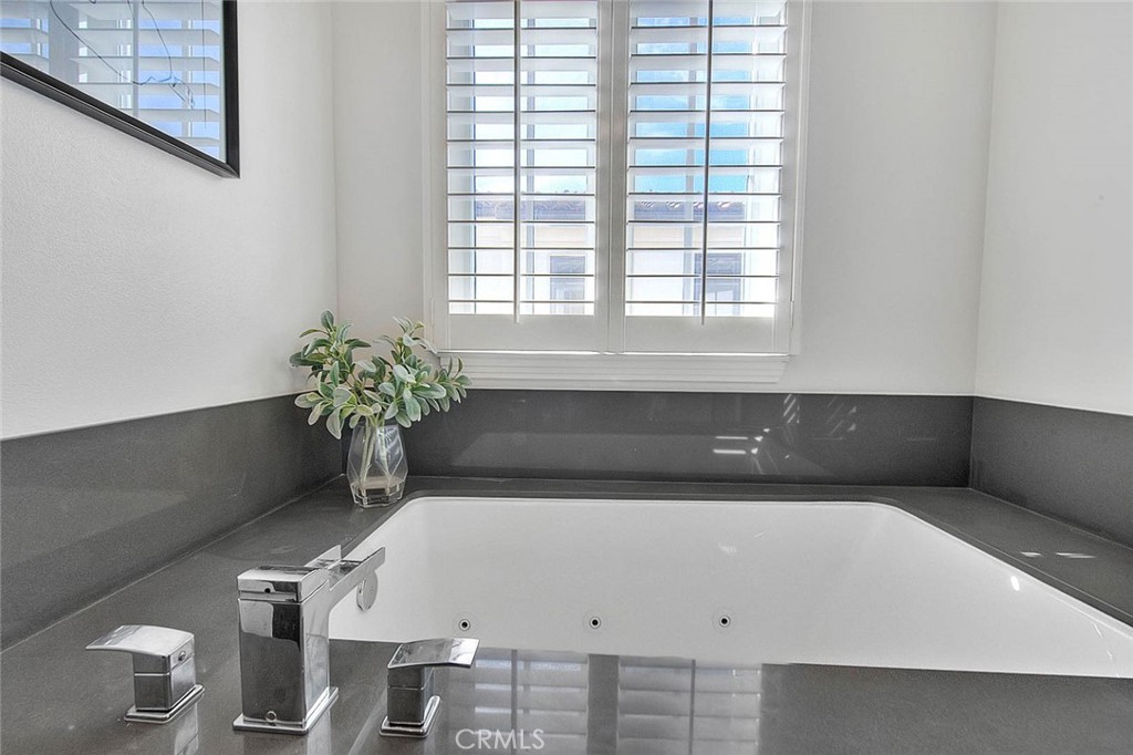 1058 Sunset Boulevard, Unit B Arcadia, CA 91007 - Photo 24 of 45 a white bath tub sitting in a bathroom next to a window