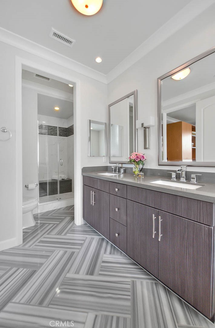 1058 Sunset Boulevard, Unit B Arcadia, CA 91007 - Photo 25 of 45 a spacious bathroom with a granite countertop sink and a mirror