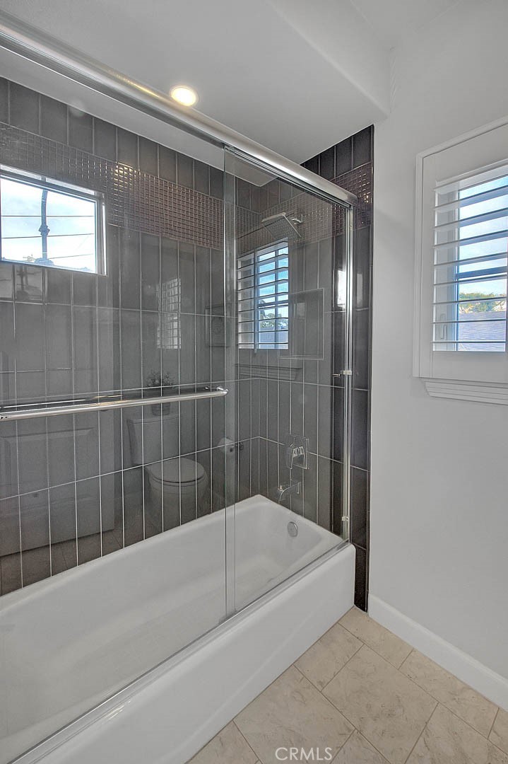 1058 Sunset Boulevard, Unit B Arcadia, CA 91007 - Photo 30 of 45 a bathroom with a bathtub and a shower