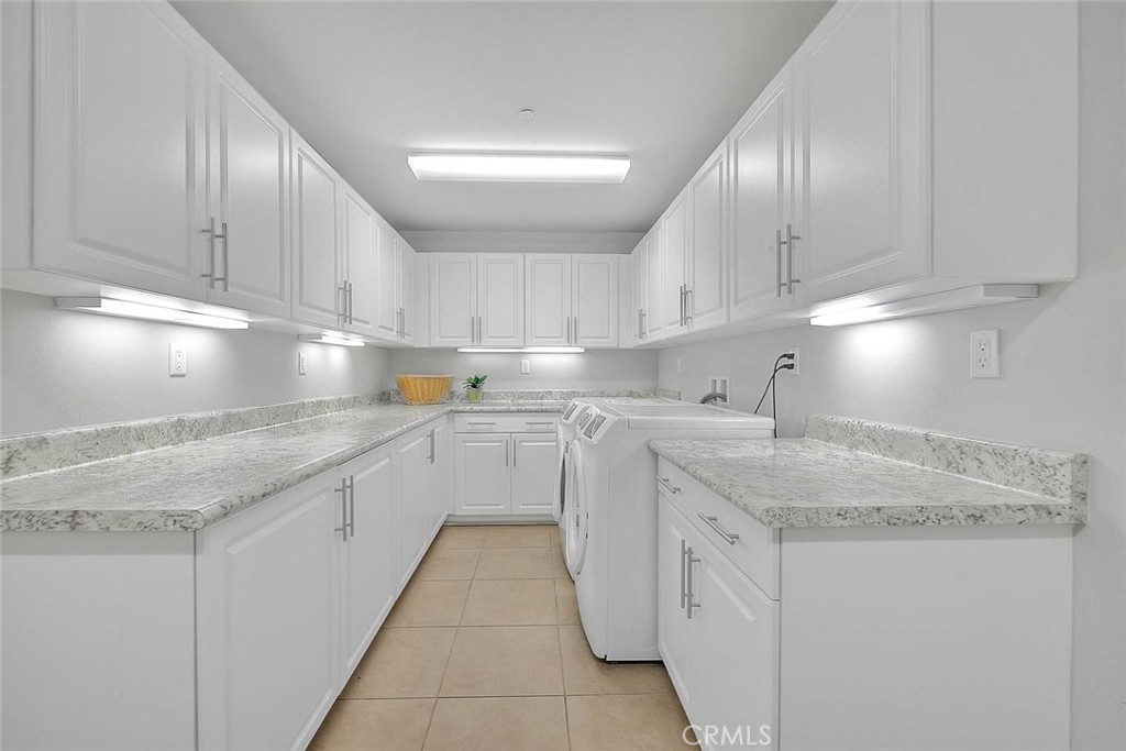 1058 Sunset Boulevard, Unit B Arcadia, CA 91007 - Photo 35 of 45 a kitchen with white cabinets sink and stove