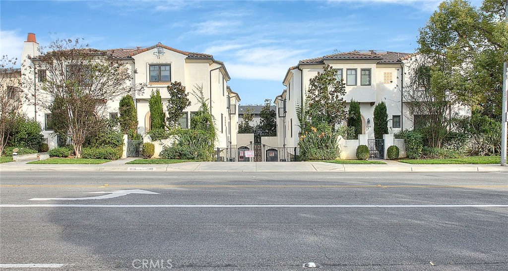 1058 Sunset Boulevard, Unit B Arcadia, CA 91007 - Photo 4 of 45 a front view of a residential apartment building with a yard