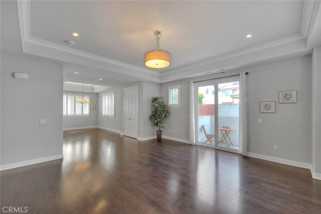 1058 Sunset Boulevard, Unit B Arcadia, CA 91007 - Photo 7 of 45 a view of an empty room with wooden floor and a window