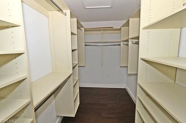 a view of storage and utility room with wooden floor