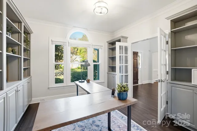 a living room with furniture dining table and a large window