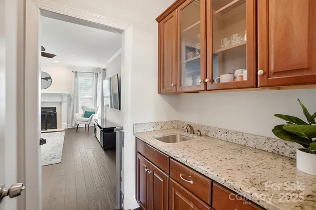 a kitchen with a sink and a stove top oven