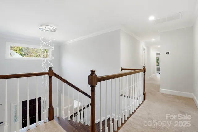 a view of a hallway with stairs