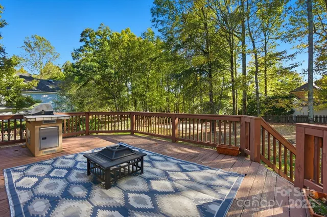 a view of a chairs and table in the balcony