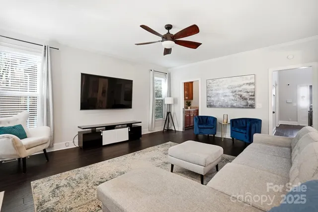 a living room with furniture fireplace and a flat screen tv