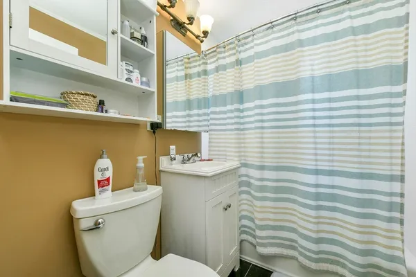 a view of a house with a door and wooden walls