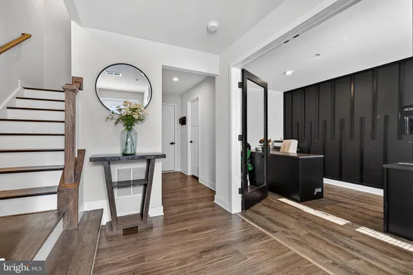 a view of a livingroom with furniture and wooden floor