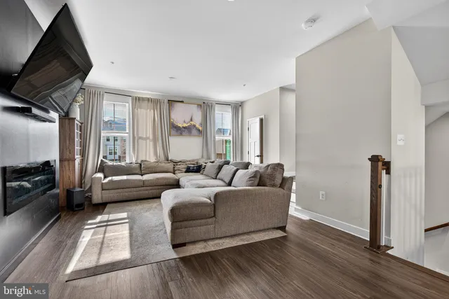 a bedroom with a bed and glass window