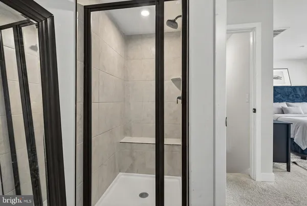 a view of a bathroom from a hallway