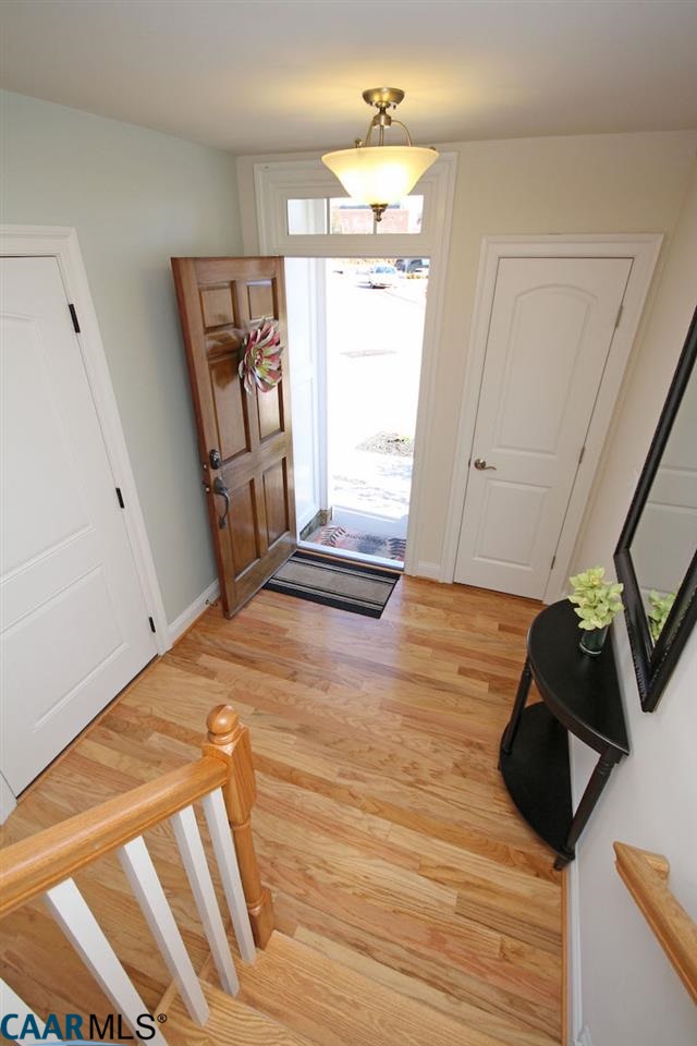 2088 Avinity Loop Charlottesville, VA 22902 - Photo 24 of 28 a view of a room with wooden floor and staircase