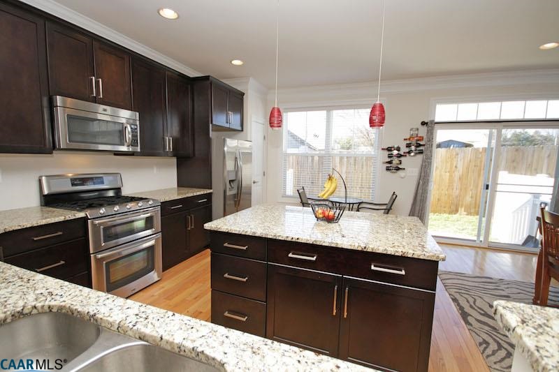 2088 Avinity Loop Charlottesville, VA 22902 - Photo 7 of 28 a kitchen with granite countertop a sink stainless steel appliances and cabinets