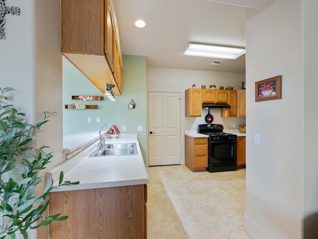 1110 Buttercup Lane Fruita, CO 81521 - Photo 11 of 27 a room with furniture and a potted plant