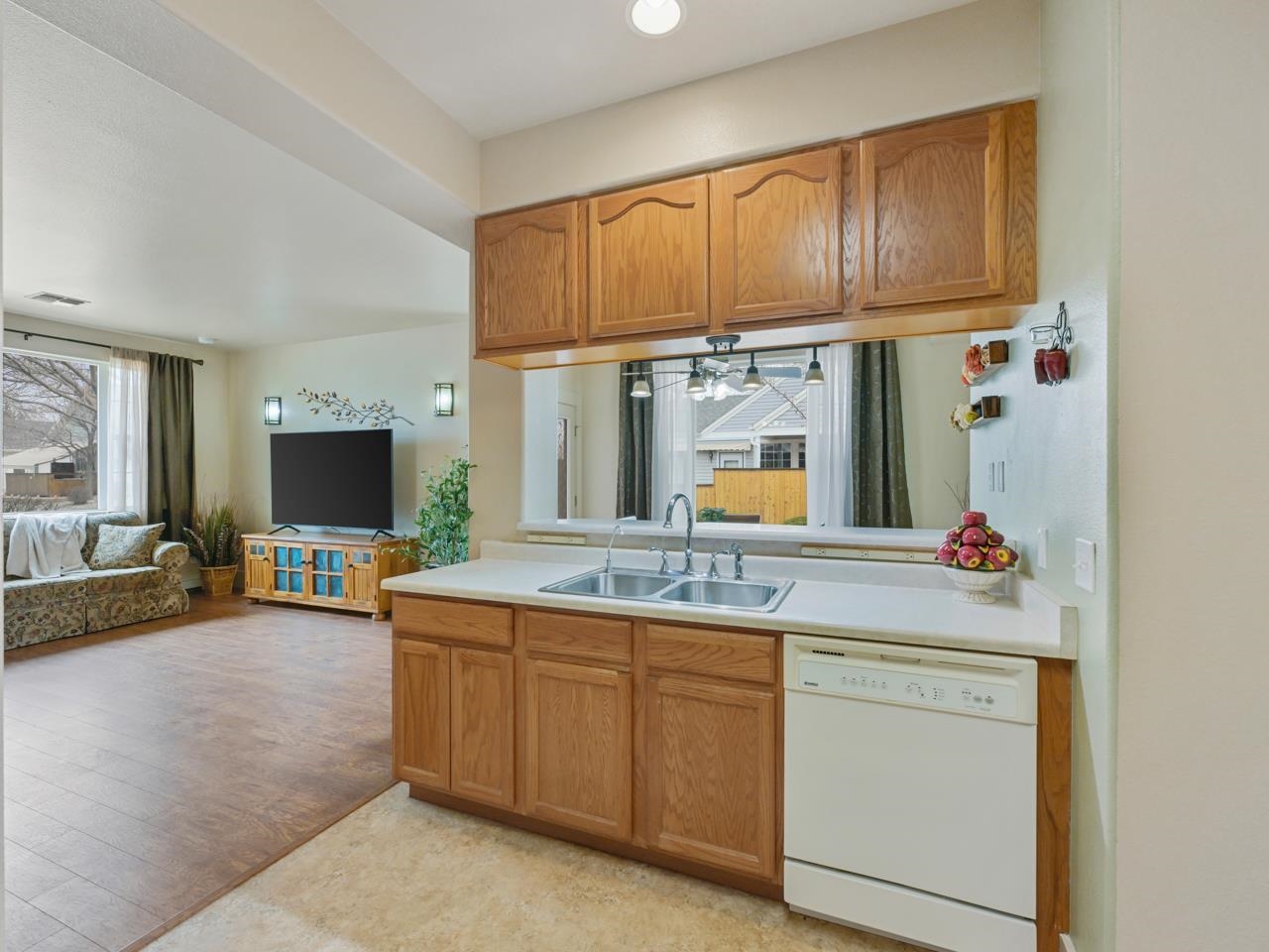 1110 Buttercup Lane Fruita, CO 81521 - Photo 12 of 27 a kitchen with a sink cabinets and wooden floor