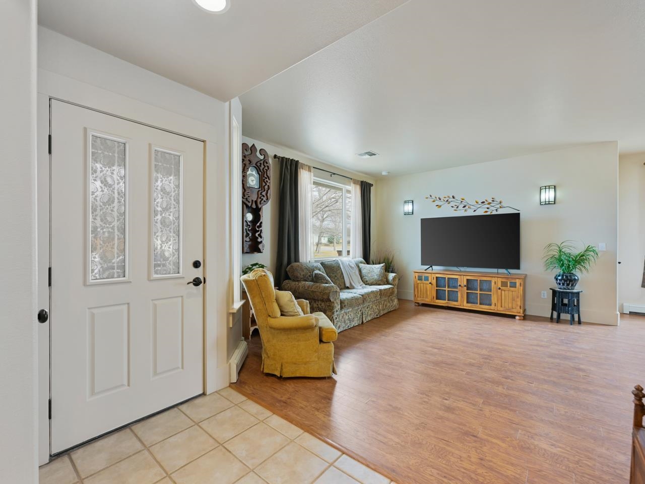 1110 Buttercup Lane Fruita, CO 81521 - Photo 6 of 27 a living room with furniture and a flat screen tv