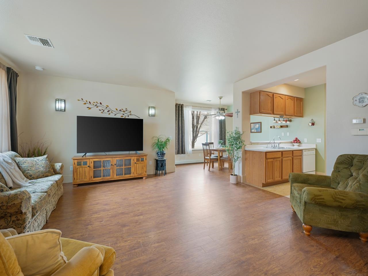 1110 Buttercup Lane Fruita, CO 81521 - Photo 7 of 27 a living room with furniture and a flat screen tv
