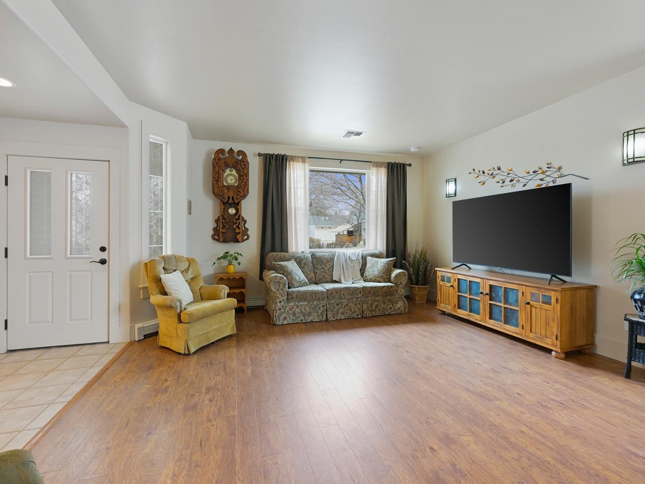 1110 Buttercup Lane Fruita, CO 81521 - Photo 9 of 27 a living room with furniture and a flat screen tv