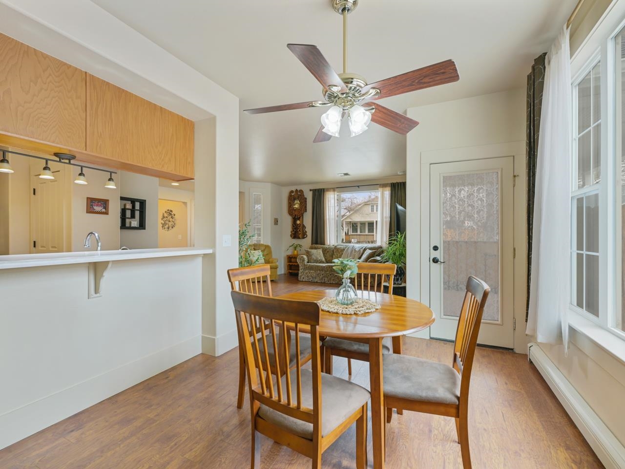 1110 Buttercup Lane Fruita, CO 81521 - Photo 10 of 27 a view of a dining room with furniture window and wooden floor